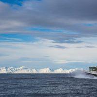 Basecamp Explorer Isfjord Expressen boat driving through arctic waters on Svalbard.